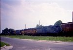 A quartet of Geeps lead a train southbound